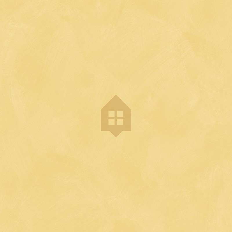 Papel pintado amarillo dorado con efecto de cal natural y textura mate, colección Chalk de Caselio.