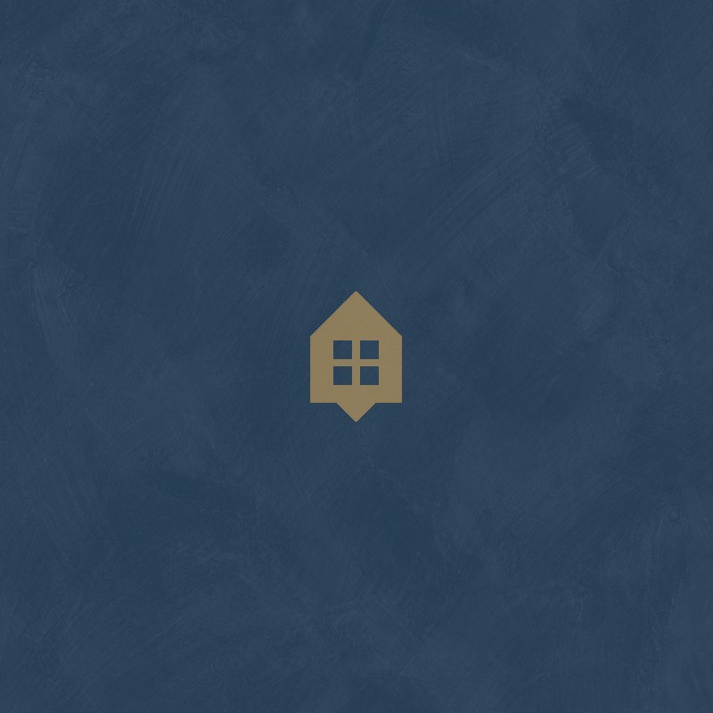 Papel pintado azul universo con efecto de cal natural y textura mate, colección Chalk de Caselio.