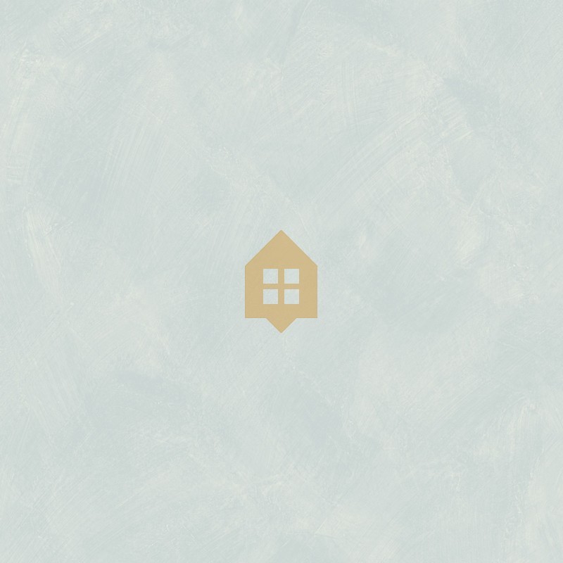 Papel pintado azul ahumado con efecto de cal natural y textura mate, colección Chalk de Caselio.