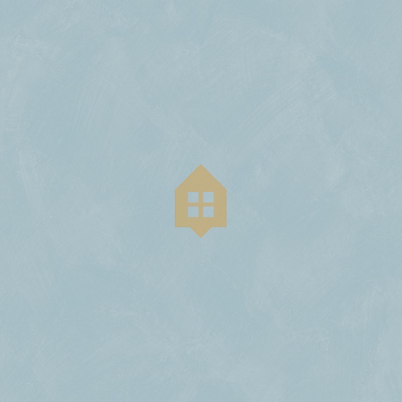 Papel pintado azul cielo con efecto de cal natural y textura mate, colección Chalk de Caselio.