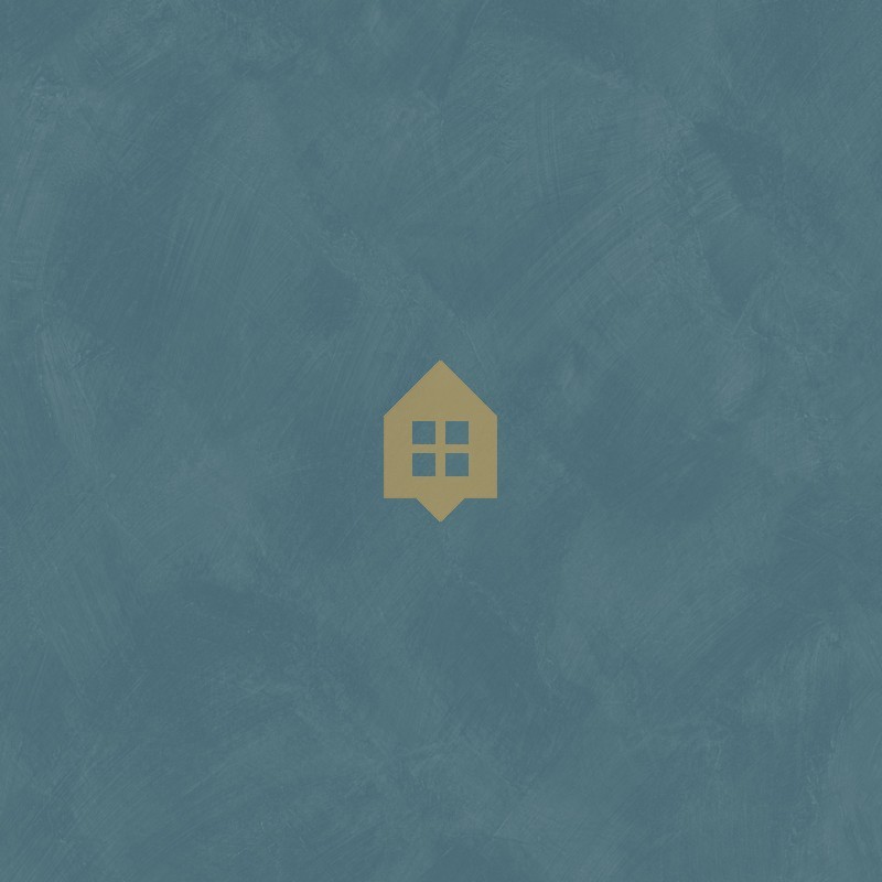 Papel pintado azul vaquero con efecto de cal natural y textura mate, colección Chalk de Caselio.