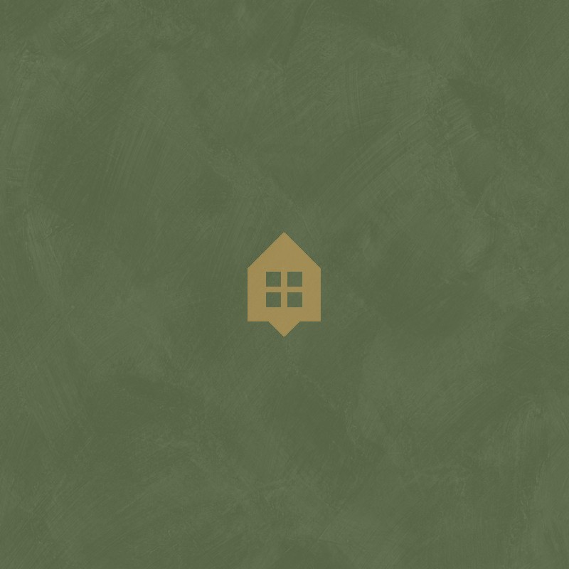 Papel pintado verde botella con efecto de cal natural y textura mate, colección Chalk de Caselio.