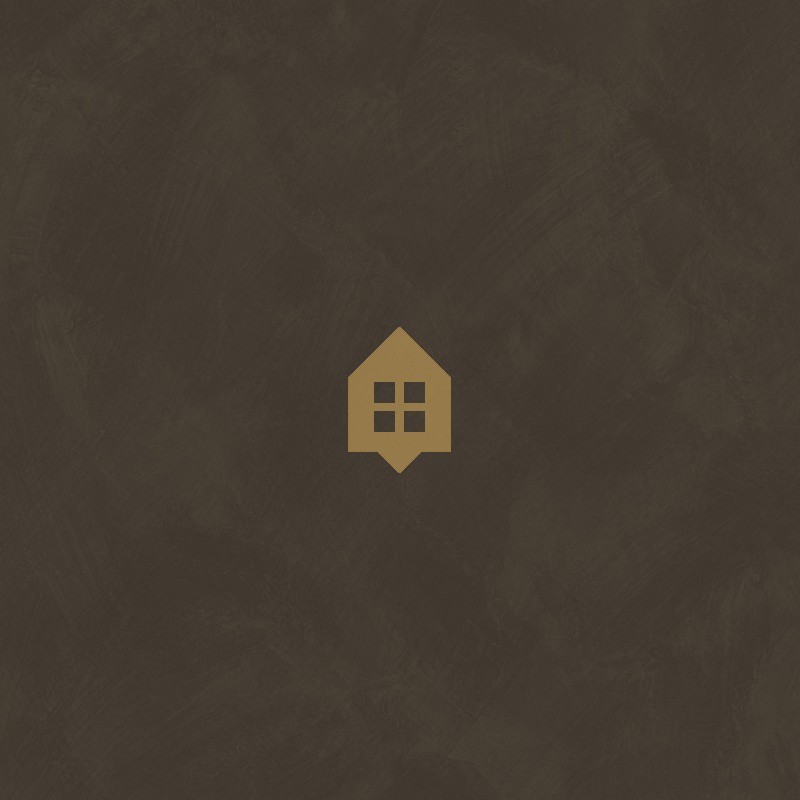 Papel pintado tierra ocre con efecto de cal natural y textura mate, colección Chalk de Caselio.