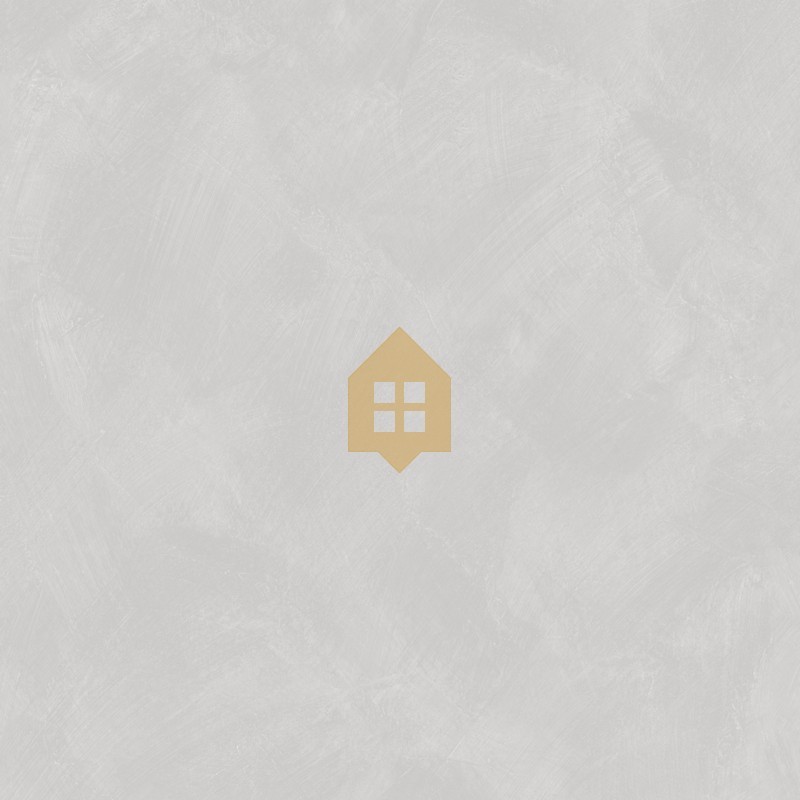 Papel pintado gris guijarro con efecto de cal natural y textura mate, colección Chalk de Caselio.